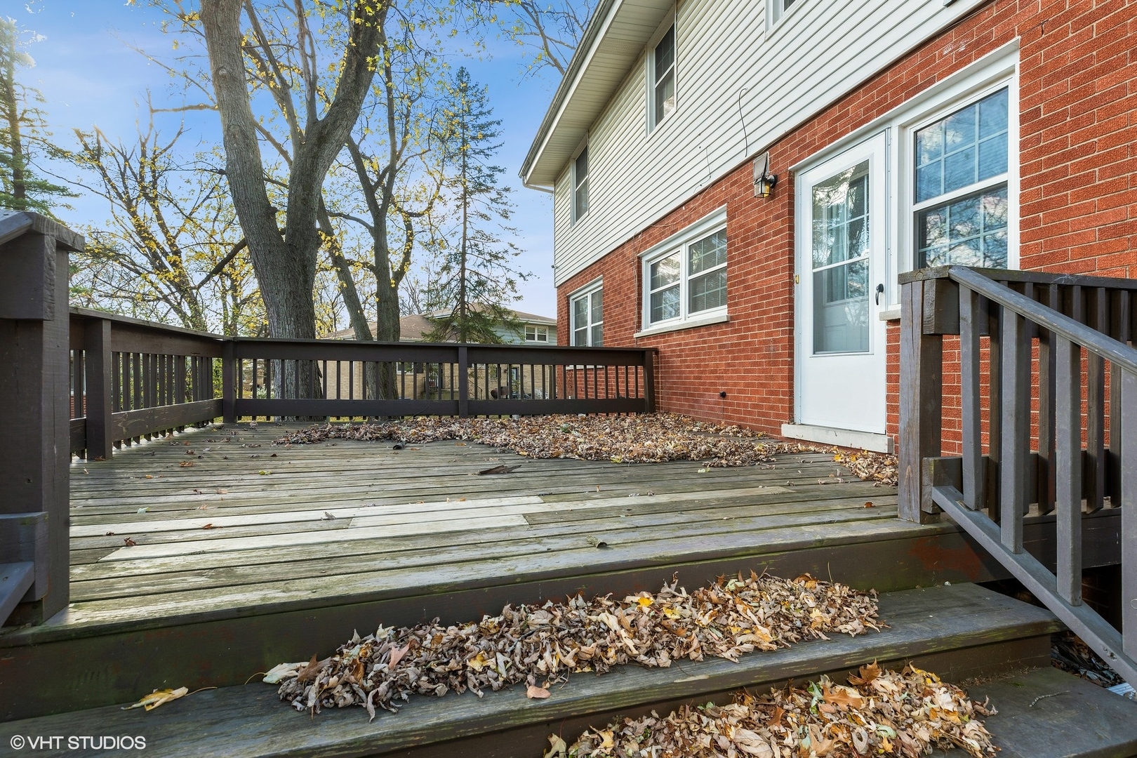 939 Maple Road Flossmoor, IL 60422 - Photo 17 of 23 a view of a house with a wooden fence