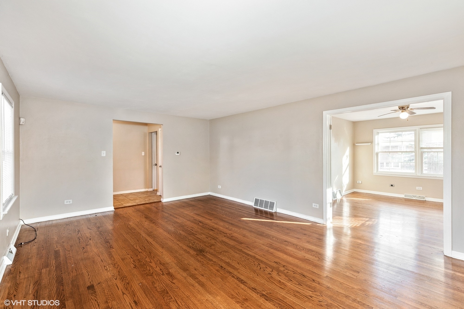 939 Maple Road Flossmoor, IL 60422 - Photo 3 of 23 wooden floor in an empty room with a window
