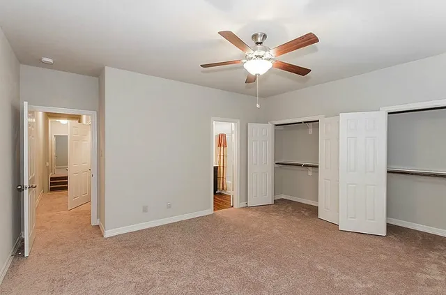 a view of a livingroom with a ceiling fan