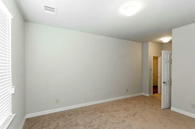 an empty room with a natural light