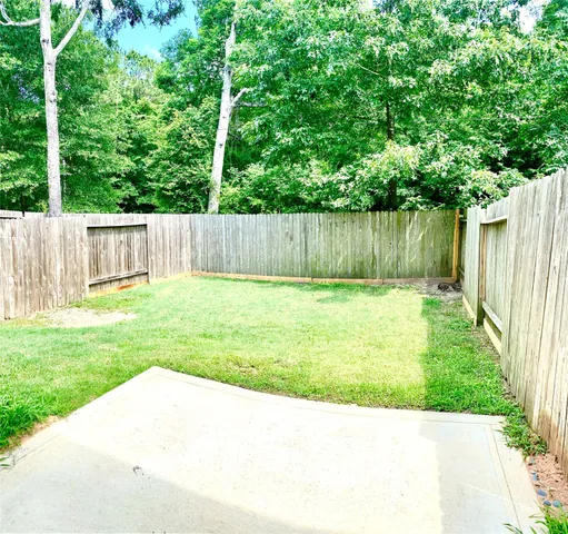 a view of backyard with green space