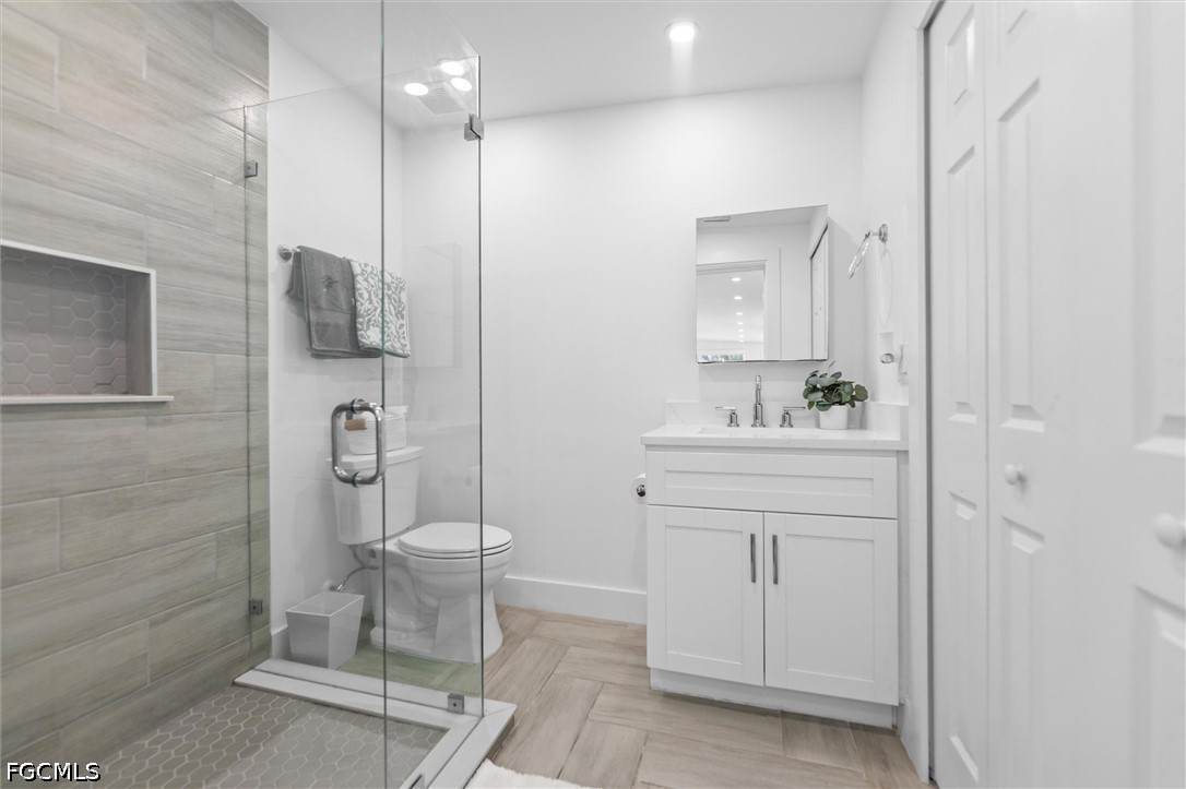 1200 Patterson Road Cape Coral, FL 33909 - Photo 28 of 42 a bathroom with a sink a toilet and shower