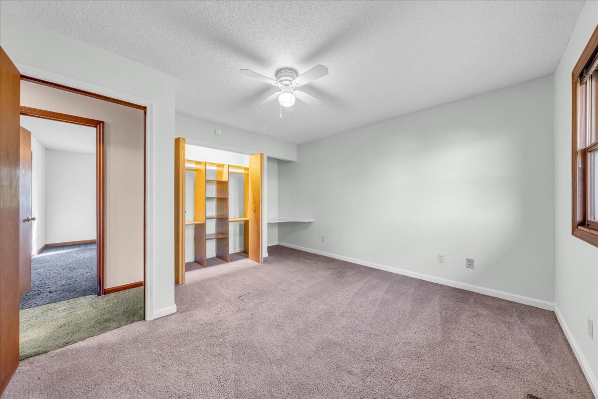 137 J D Ring Road Hillsboro, TN 37342 - Photo 23 of 49 an empty room with closet and a ceiling fan