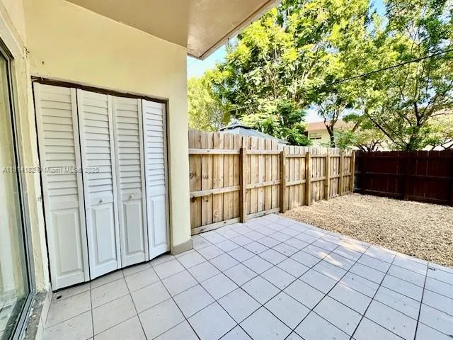 a view of a backyard of the house