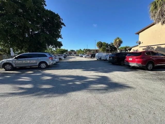 a view of street with parked cars