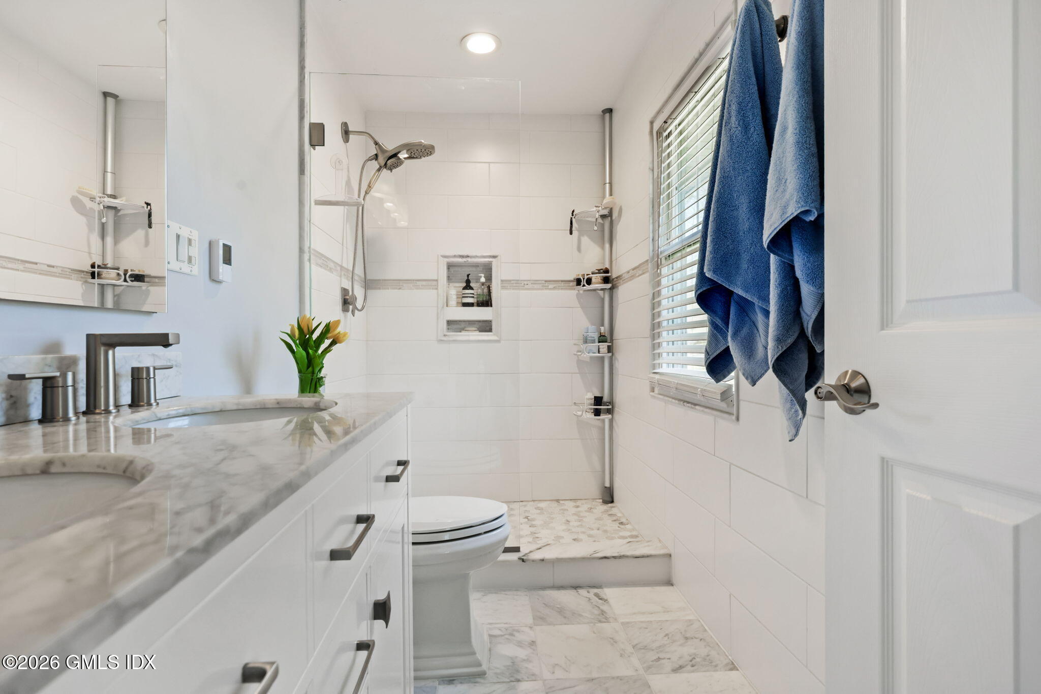97 Davenport Ridge Lane Stamford, CT 06903 - Photo 17 of 31 a bathroom with a granite countertop sink a toilet and shower
