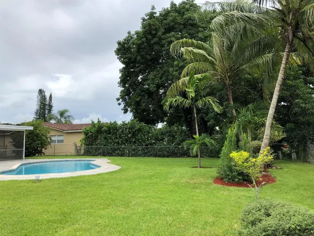 a view of a swimming pool with a garden