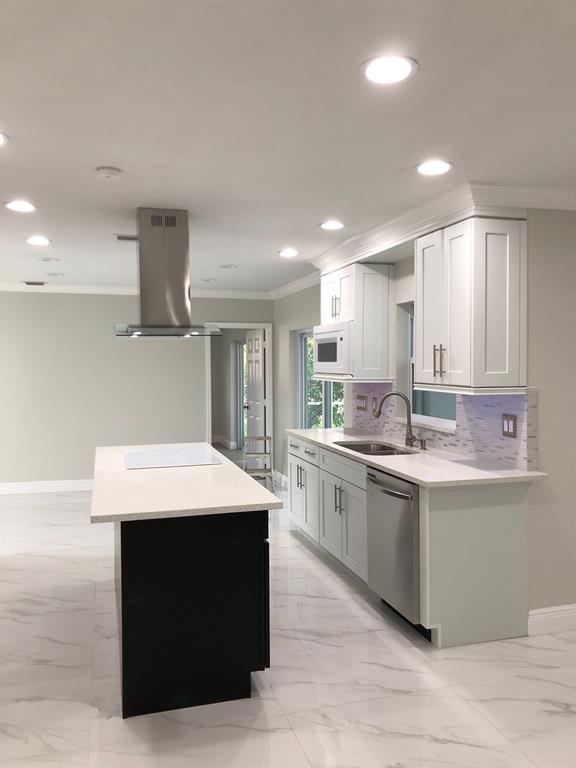 3980 Northwest 109th Avenue Coral Springs, FL 33065 - Photo 5 of 12 a kitchen with a sink dishwasher a stove and a refrigerator with wooden floor