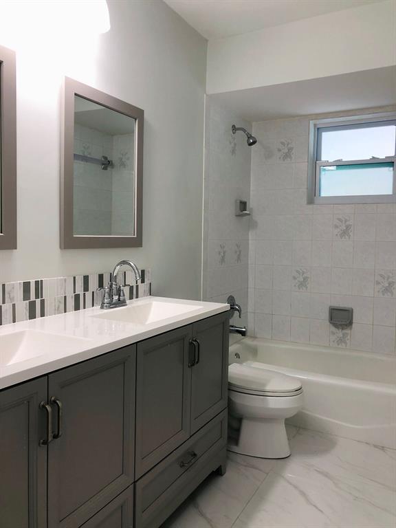 3980 Northwest 109th Avenue Coral Springs, FL 33065 - Photo 10 of 12 a bathroom with a sink toilet and shower