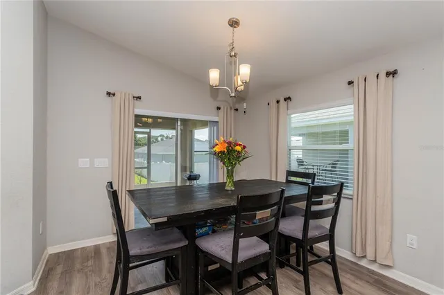 a dining room with furniture and window