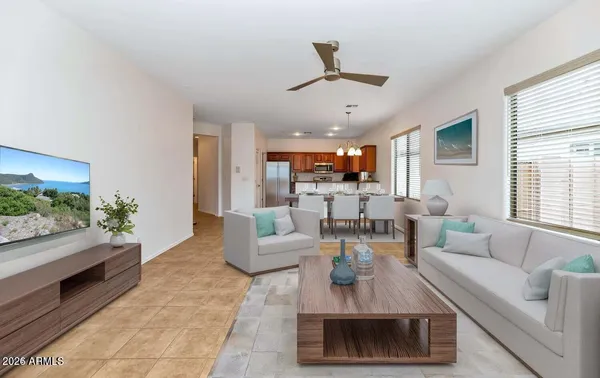 a living room with furniture and a large window