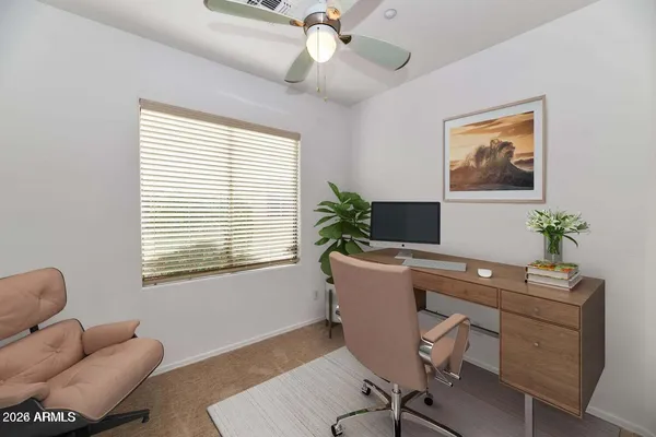 a workspace with furniture and a window