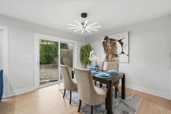a dining room with furniture and window