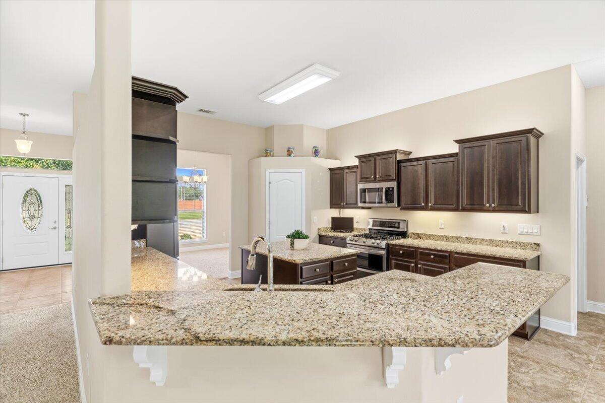 2256 Reed Ridge Court Navarre, FL 32566 - Photo 12 of 44 L shape kitchen bar