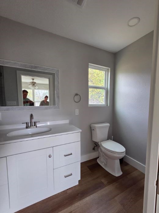 505 East Lane Kerrville, TX 78028 - Photo 7 of 10 a bathroom with a toilet sink and mirror