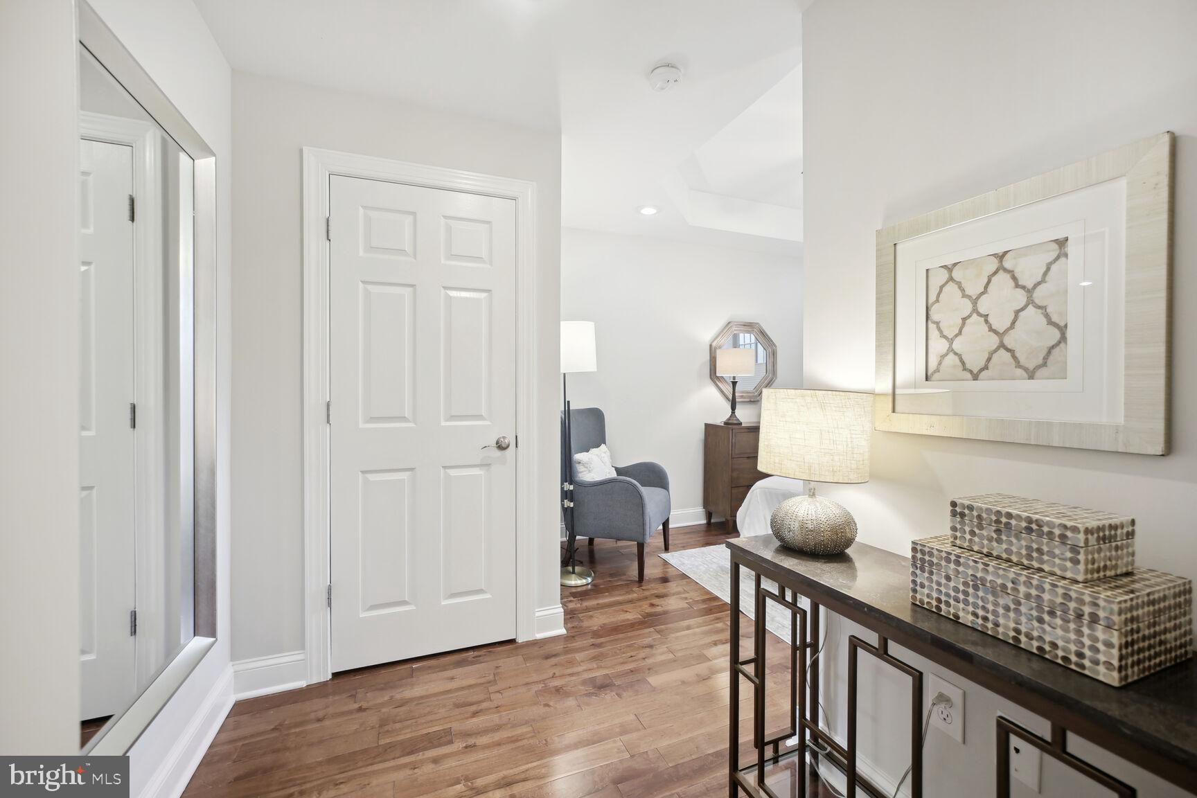 1451 Park Road Northwest, Unit 113 Washington, DC 20010 - Photo 19 of 50 a view of hall way with furniture and wooden floor
