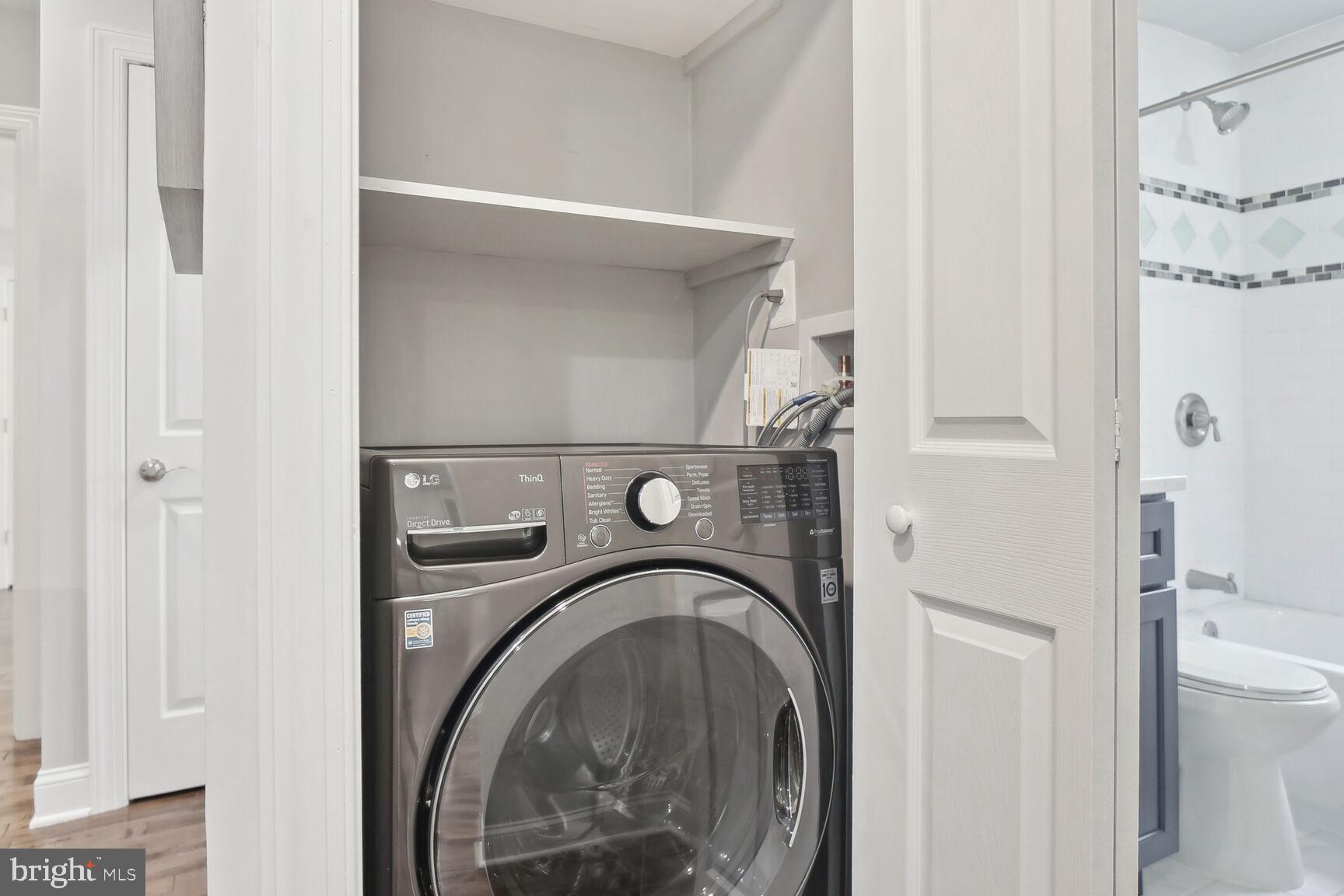 1451 Park Road Northwest, Unit 113 Washington, DC 20010 - Photo 33 of 50 a utility room with dryer and washer