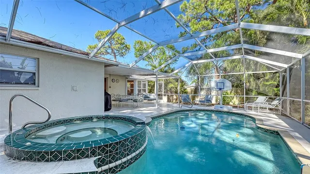 a view of a swimming pool with a patio