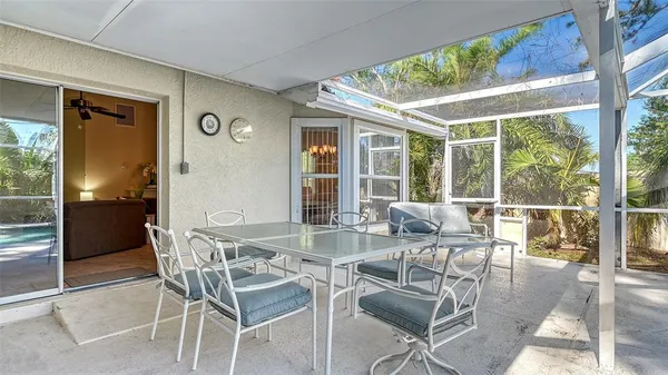 a dining room with furniture window and outside view