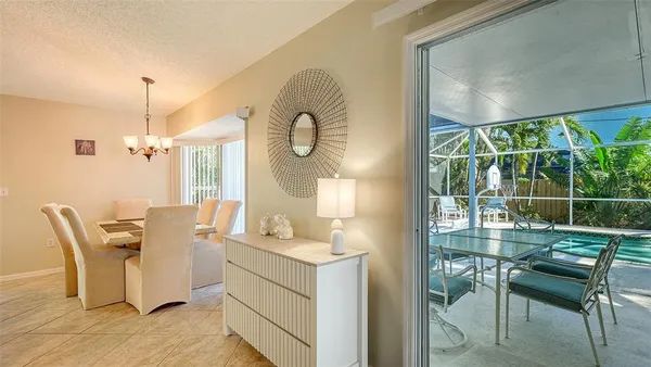 a room with table and chairs