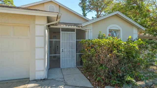 a view of a house with a yard and garage