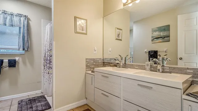 a bathroom with a sink and a mirror