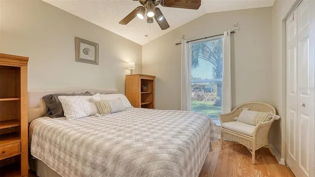 a bedroom with a bed and a chair