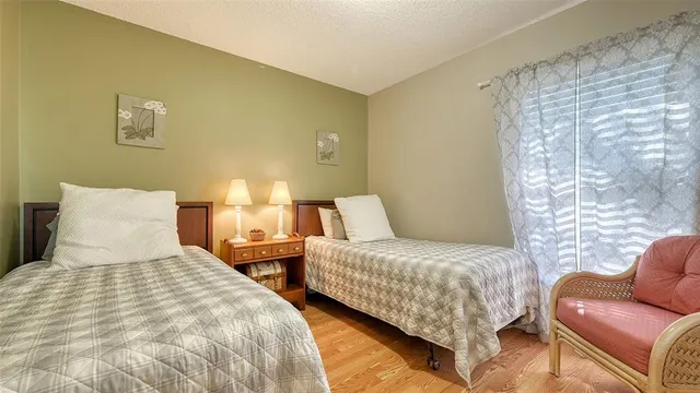 a bedroom with two beds and a couch