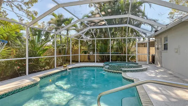 a view of a backyard with a swimming pool