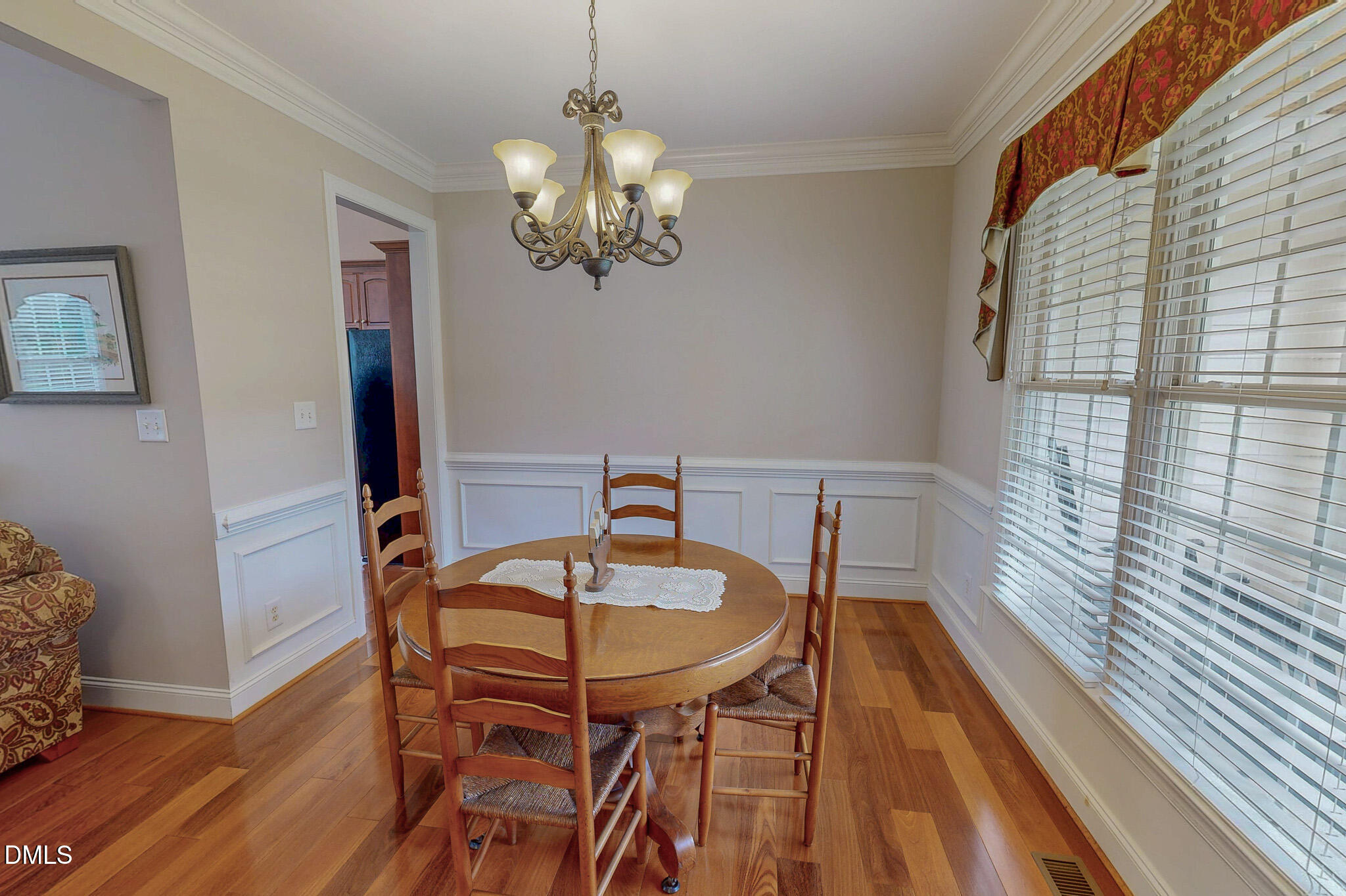115 Duncan Plantation Road Timberlake, NC 27583 - Photo 8 of 48 a view of a dining room with furniture a chandelier and wooden floor