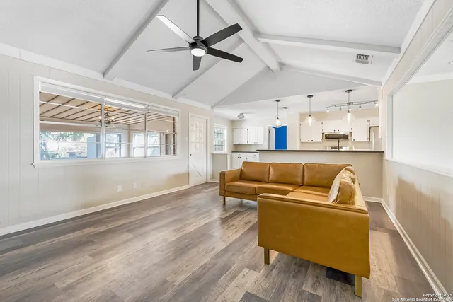 a living room with furniture and a window