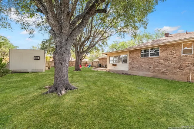 a backyard of a house with lots of green space
