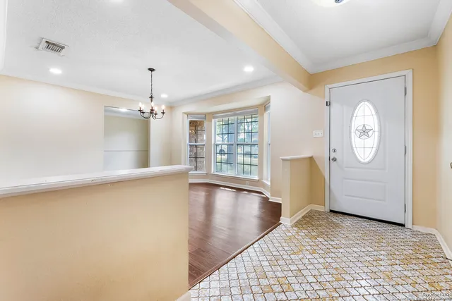 a view of a room with window and wooden floor