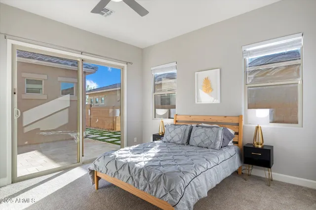 a bedroom with a bed and a night stand