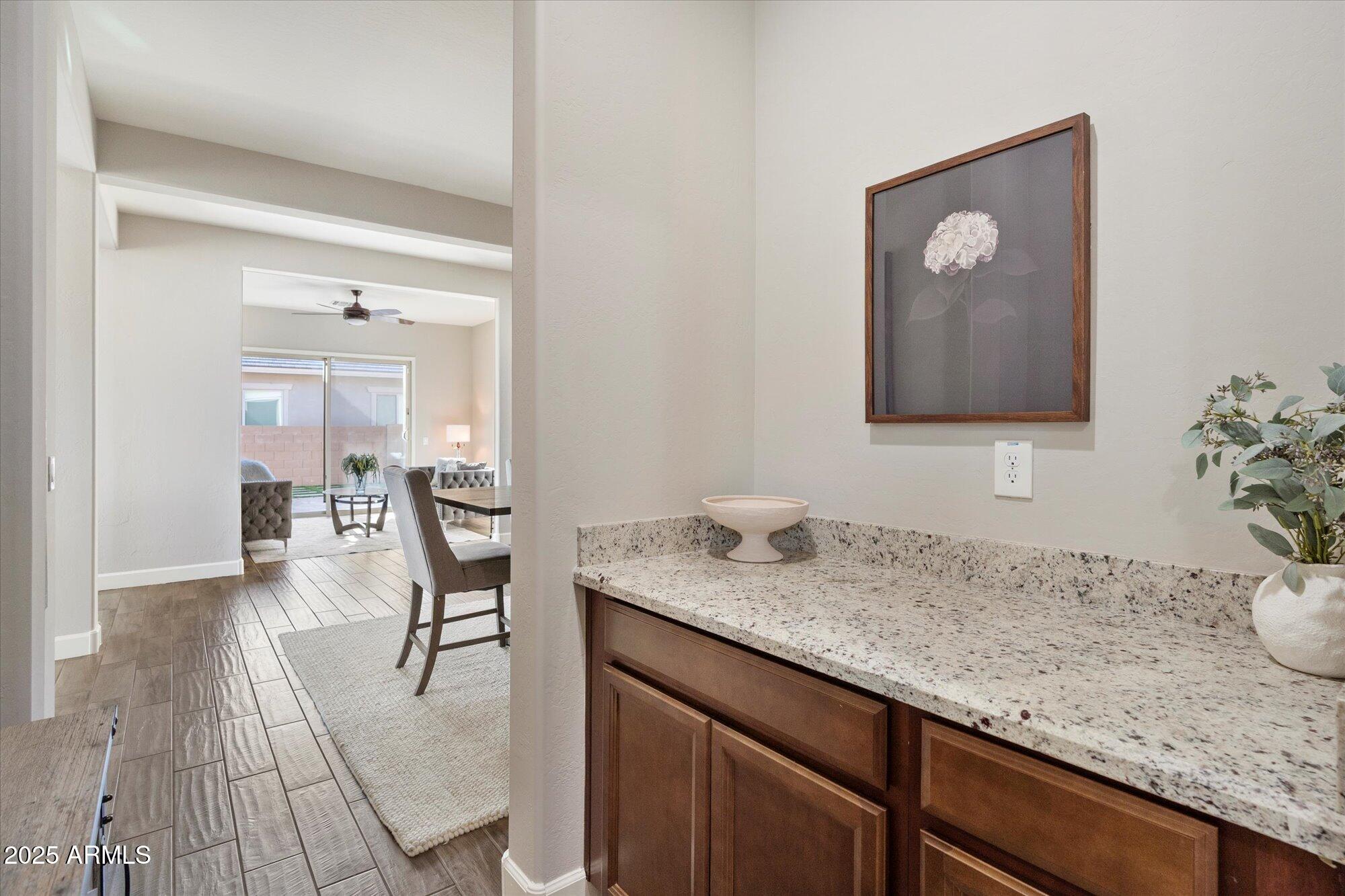 9275 West Plum Road Peoria, AZ 85383 - Photo 24 of 39 a en suite bathroom with a granite countertop sink
