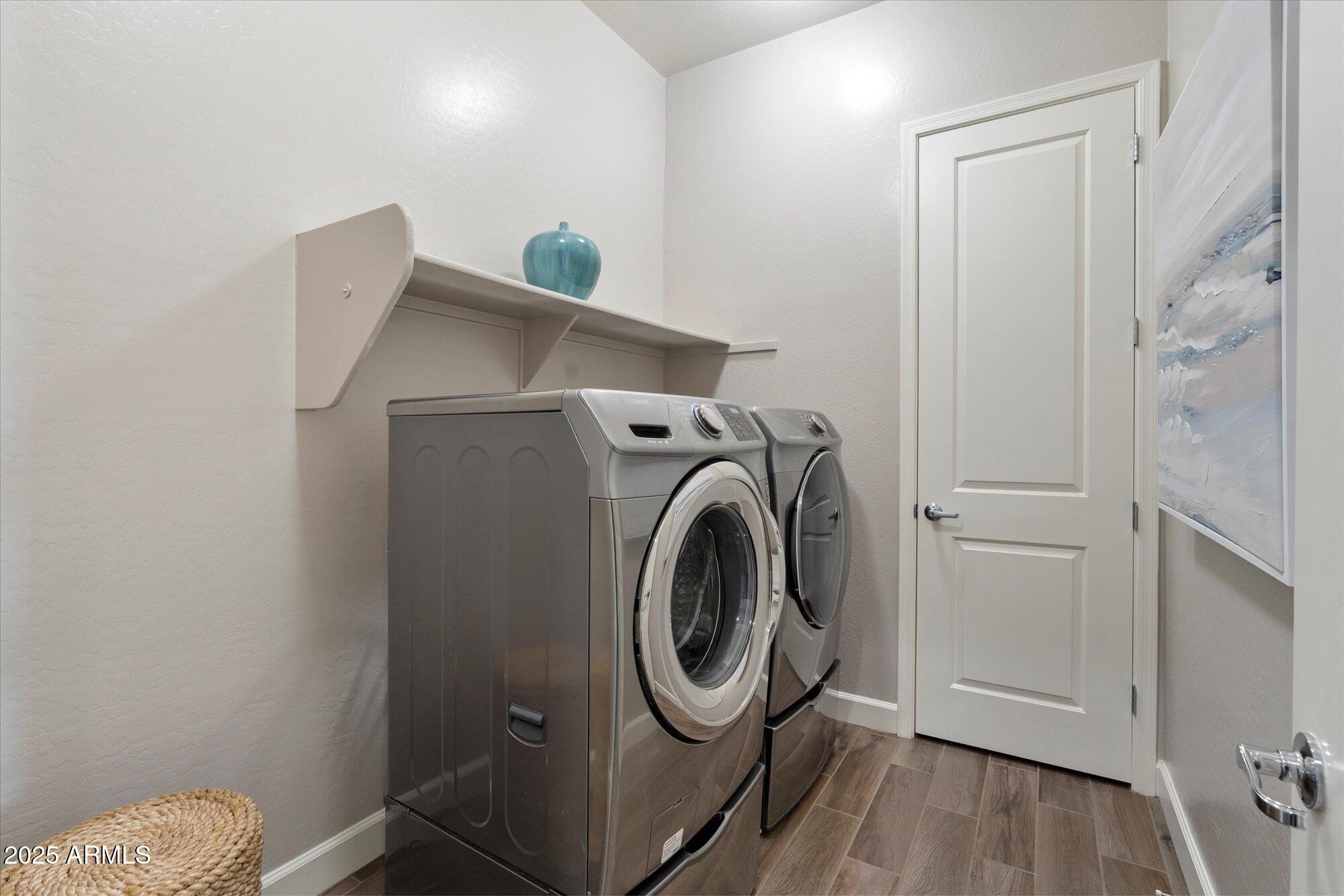 9275 West Plum Road Peoria, AZ 85383 - Photo 27 of 39 a utility room with dryer and washer