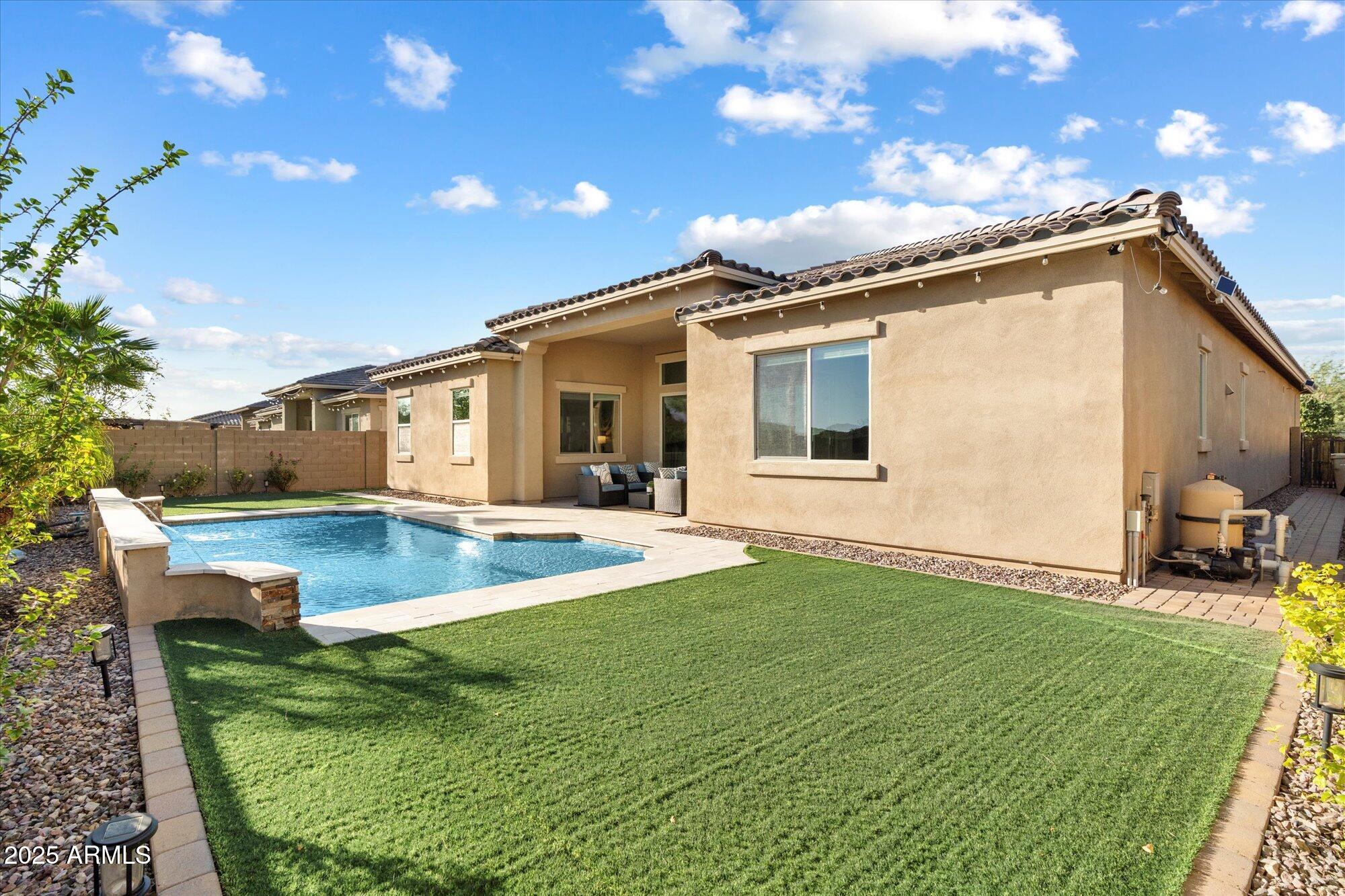 9275 West Plum Road Peoria, AZ 85383 - Photo 29 of 39 a view of a house with backyard and sitting area