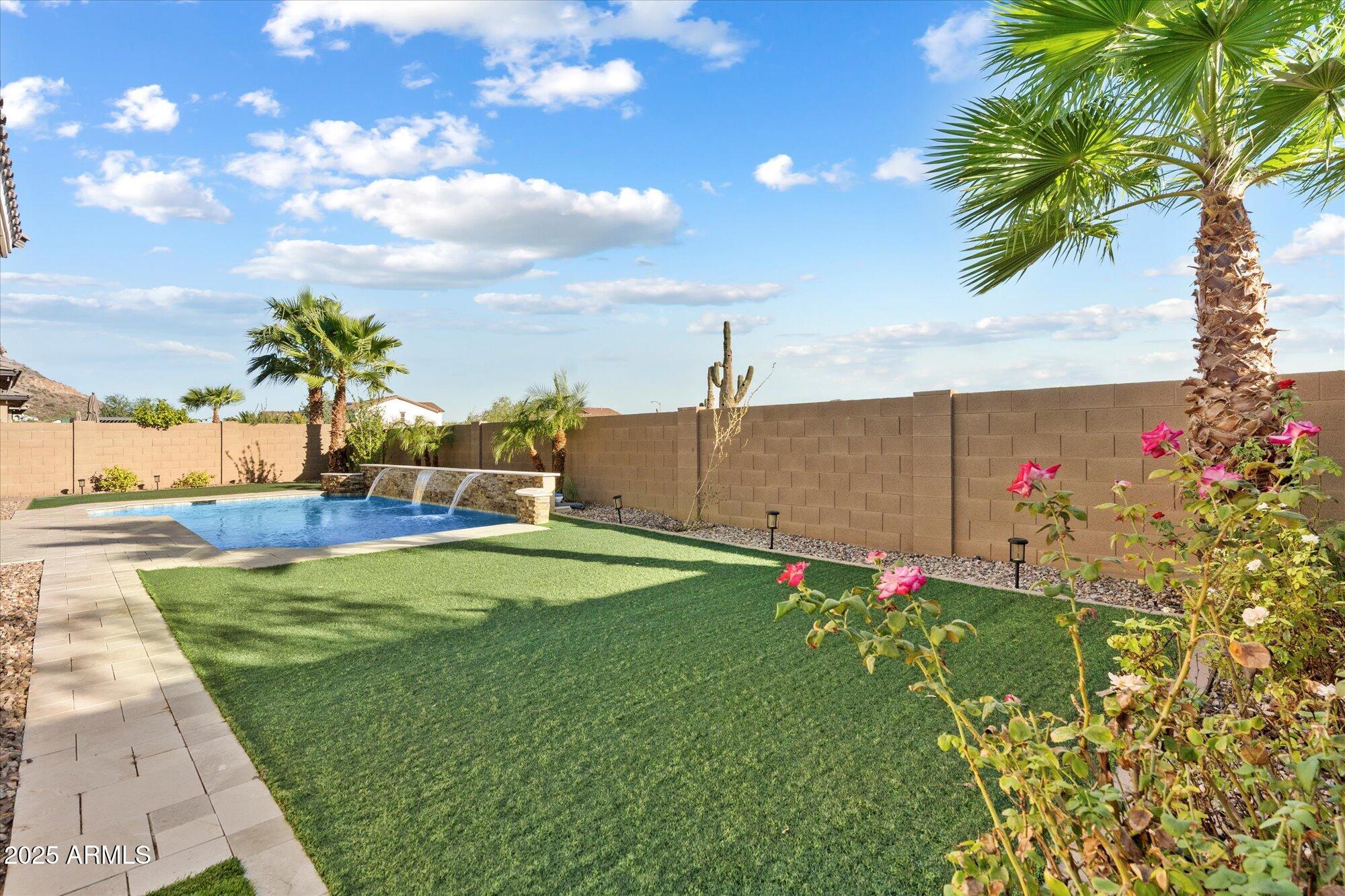 9275 West Plum Road Peoria, AZ 85383 - Photo 32 of 39 a view of a backyard