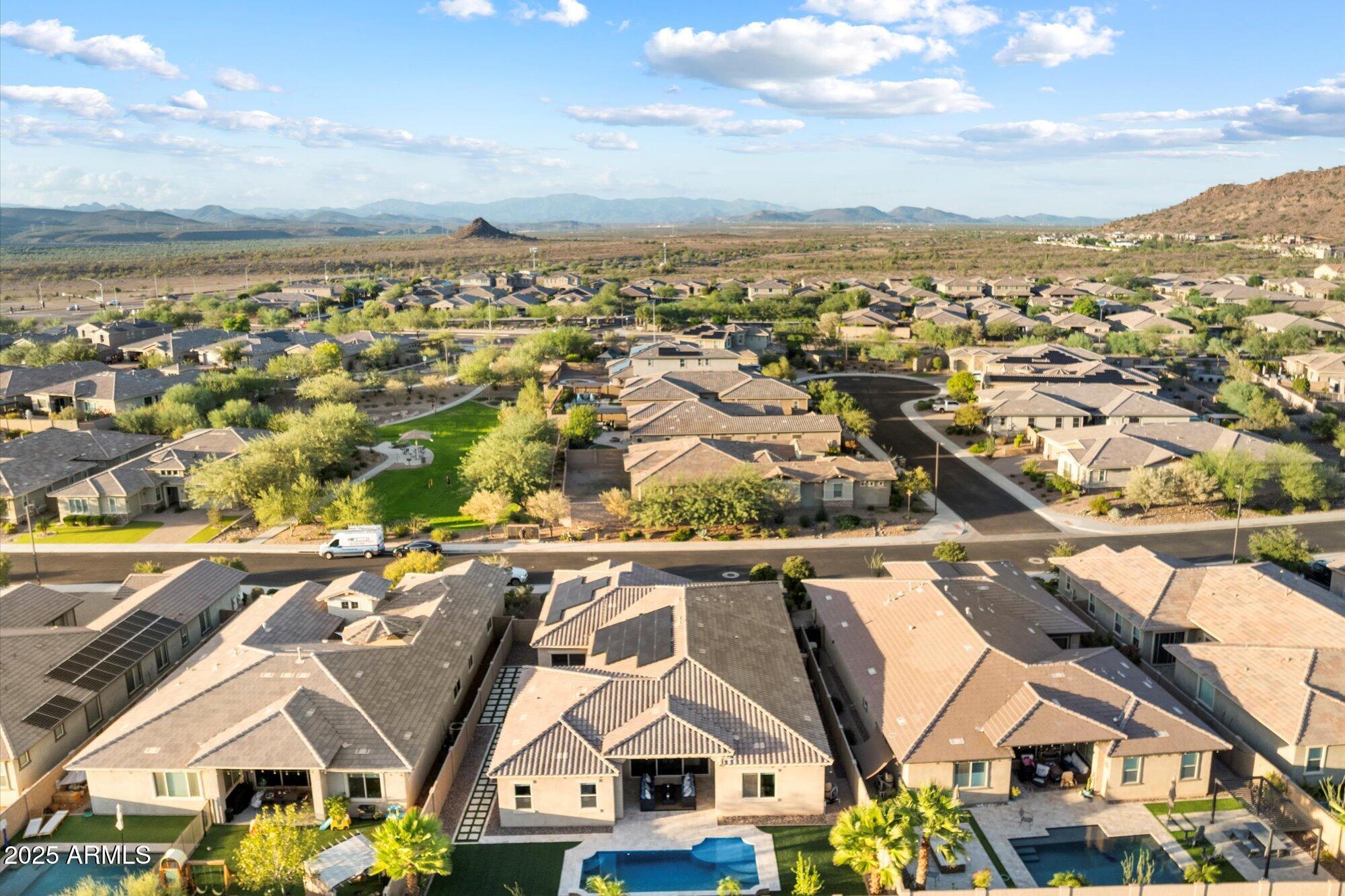 9275 West Plum Road Peoria, AZ 85383 - Photo 37 of 39 an aerial view of residential houses with outdoor space