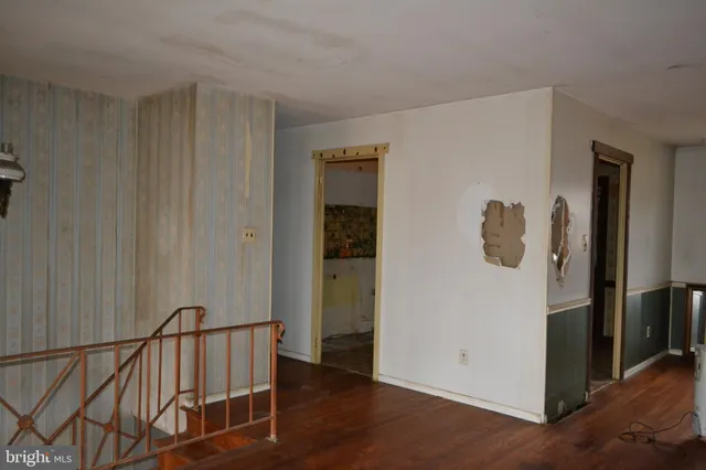 a view of a hallway with entryway door