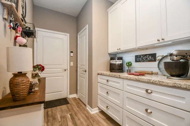 a kitchen with a sink and cabinets