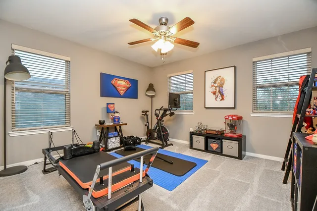 a room with gym equipment and a window