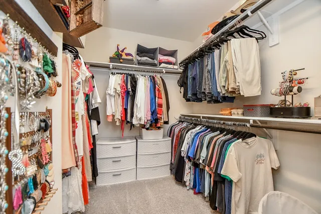 a bathroom with a granite countertop sink mirror and a bathtub