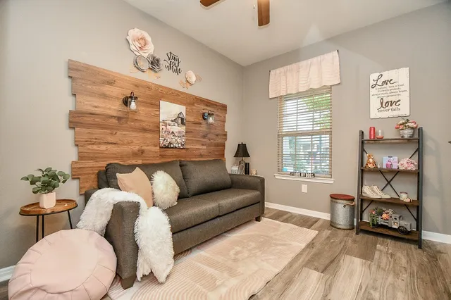 a living room with furniture and a window