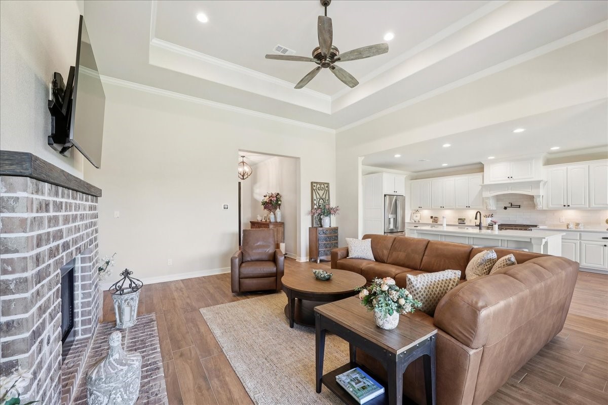9205 Chicory Street Beaumont, TX 77713 - Photo 12 of 43 a living room with furniture and a flat screen tv