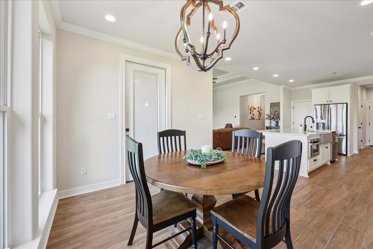 9205 Chicory Street Beaumont, TX 77713 - Photo 14 of 43 a view of a dining room with furniture