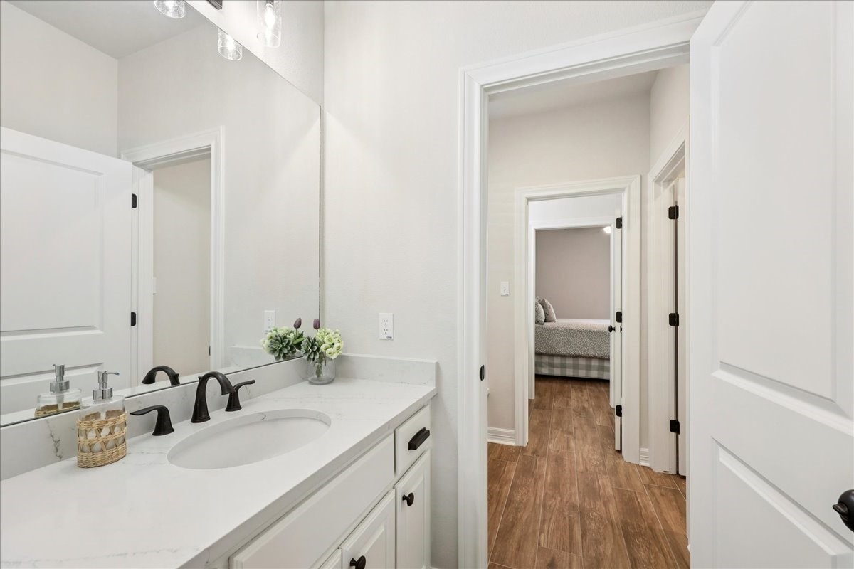 9205 Chicory Street Beaumont, TX 77713 - Photo 24 of 43 a bathroom with a sink and a mirror
