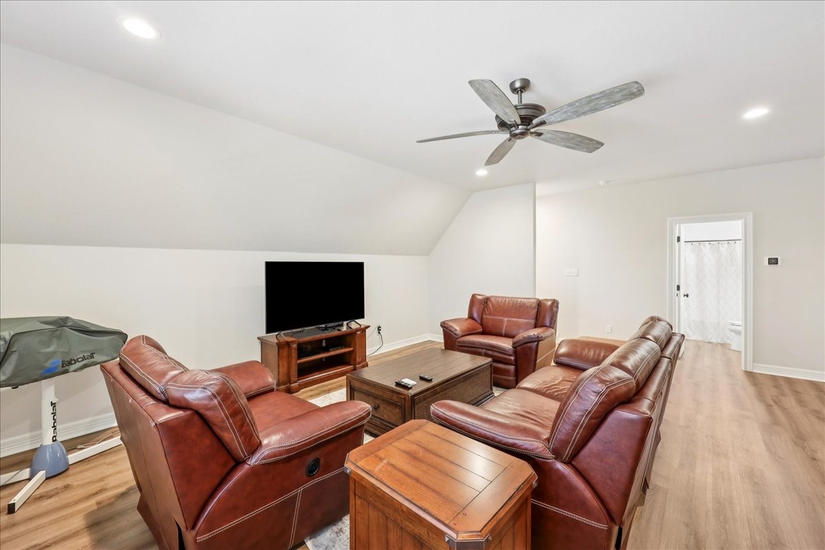 9205 Chicory Street Beaumont, TX 77713 - Photo 31 of 43 a living room with furniture and a flat screen tv