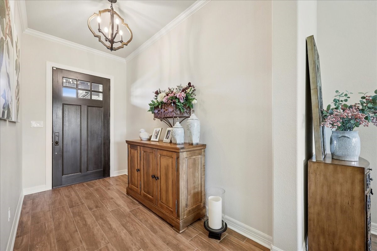 9205 Chicory Street Beaumont, TX 77713 - Photo 7 of 43 a very nice looking room with a chandelier