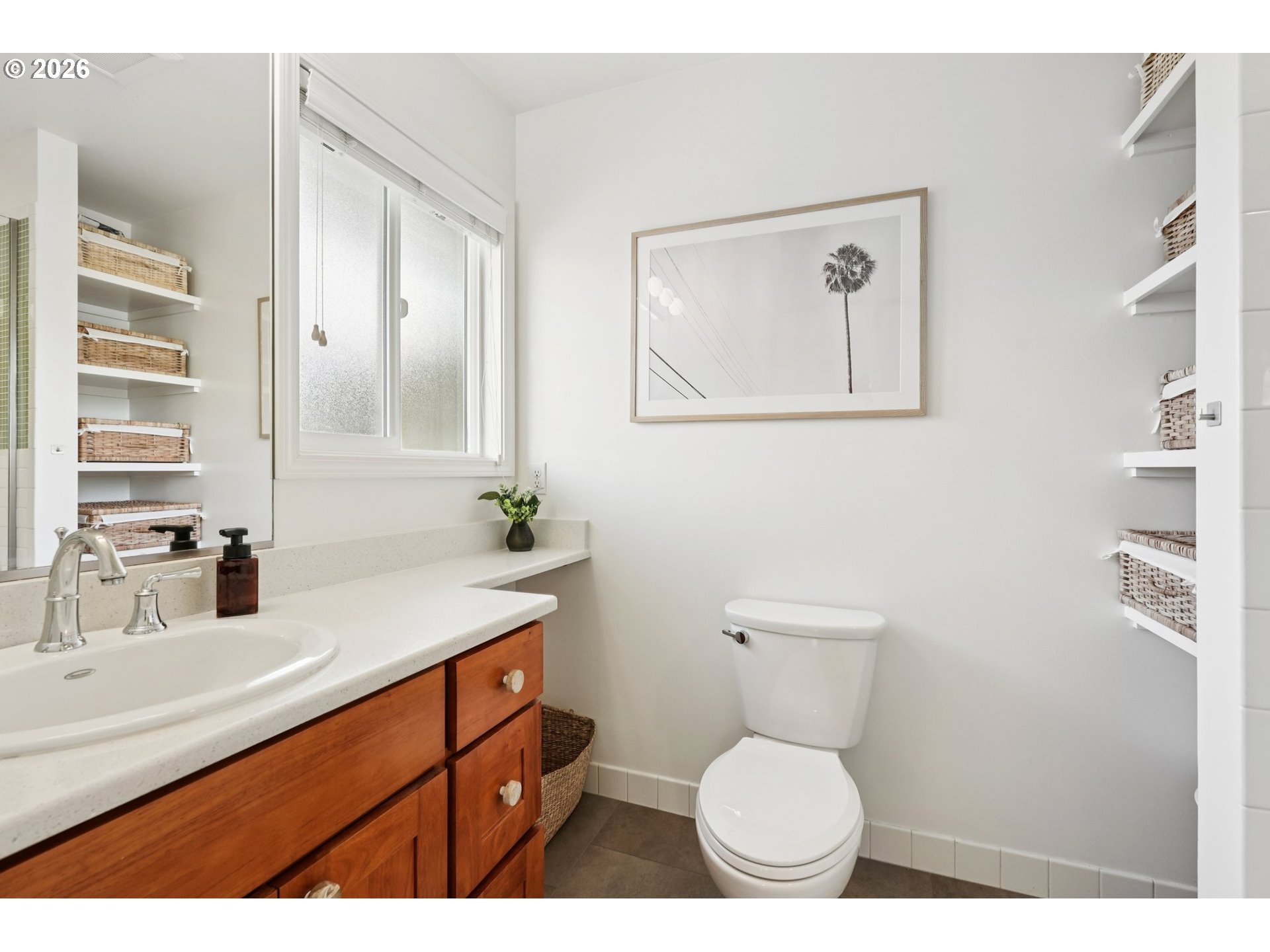 7225 Southwest 13th Avenue Portland, OR 97219 - Photo 22 of 48 a bathroom with a toilet sink and mirror